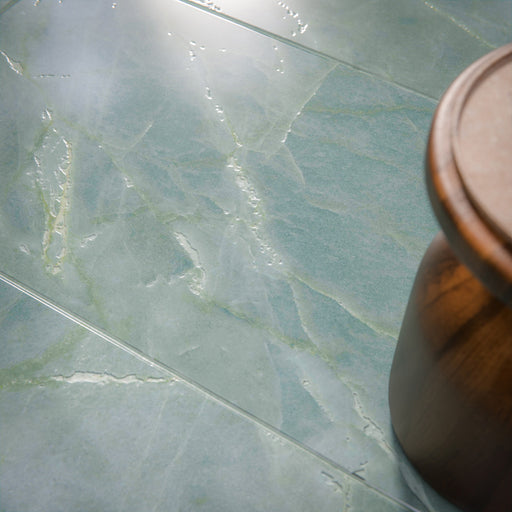 Close-up of Bassano Sea Green Lux 3D 60 × 120cm marble-effect wall and floor tiles, featuring soft sea green tones, subtle natural veining, and a luxurious polished contemporary finish.