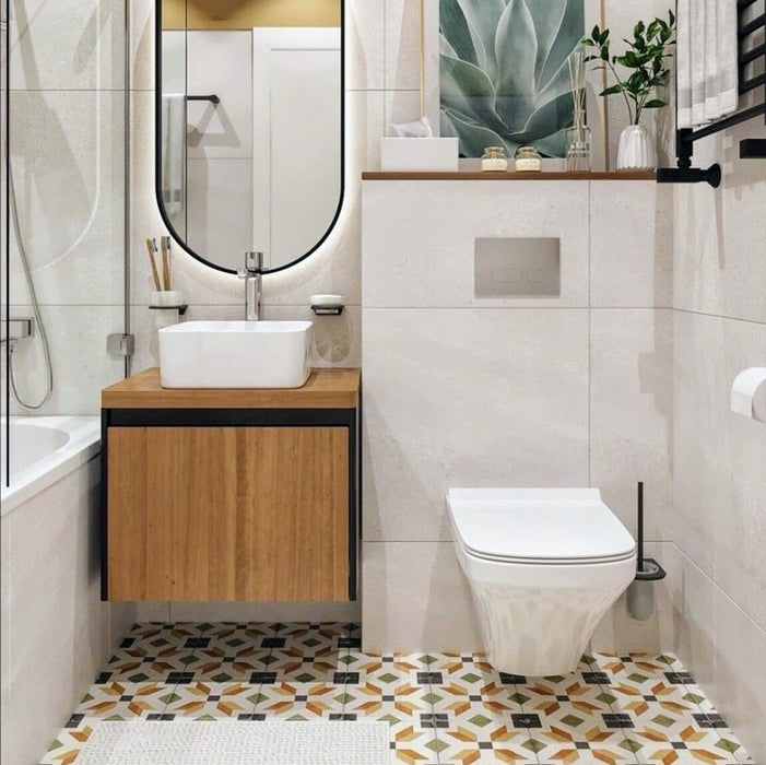 Bathroom setting featuring Carnaby High Street 20x20cm Victorian style wall and floor tiles, showcasing a geometric pattern in warm ochre, green and charcoal tones, paired with soft neutral walls, wood finishes and matte black fittings for a clean, contemporary look.