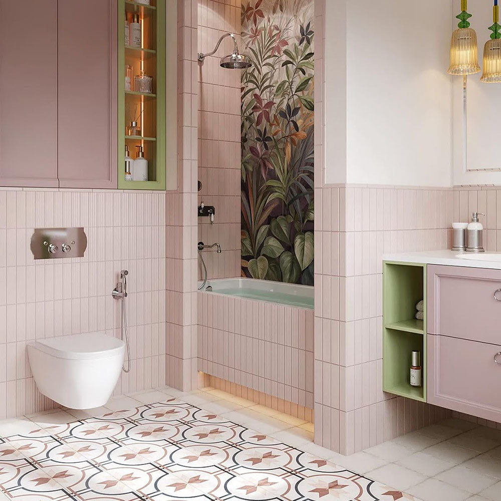 Bathroom interior featuring Rippled Brick Base 5 x 20cm wall tiles in Stony Pink with a gloss finish, installed vertically to enhance height and texture, paired with soft blush cabinetry, warm metallic accents, and a patterned floor to create a calm yet characterful space.