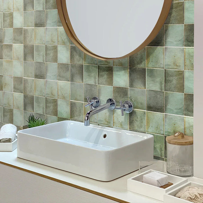 Bathroom featuring Beijing Celadon Green Square 10cm x 10cm Moroccan-style ceramic wall tiles, styled with a white countertop basin, chrome fittings and natural wood accents.