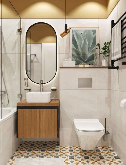 Bathroom setting featuring Carnaby High Street 20x20cm Victorian style wall and floor tiles, showcasing a geometric pattern in warm ochre, green and charcoal tones, paired with soft neutral walls, wood finishes and matte black fittings for a clean, contemporary look.
