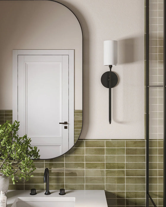 Bathroom setting featuring Atlas Verde Mini Brick 5x15cm gloss wall tiles, laid in a horizontal brick format to introduce depth and rhythm across the space. The rich green tone and reflective gloss finish enhance light and movement, creating a confident yet calming backdrop.