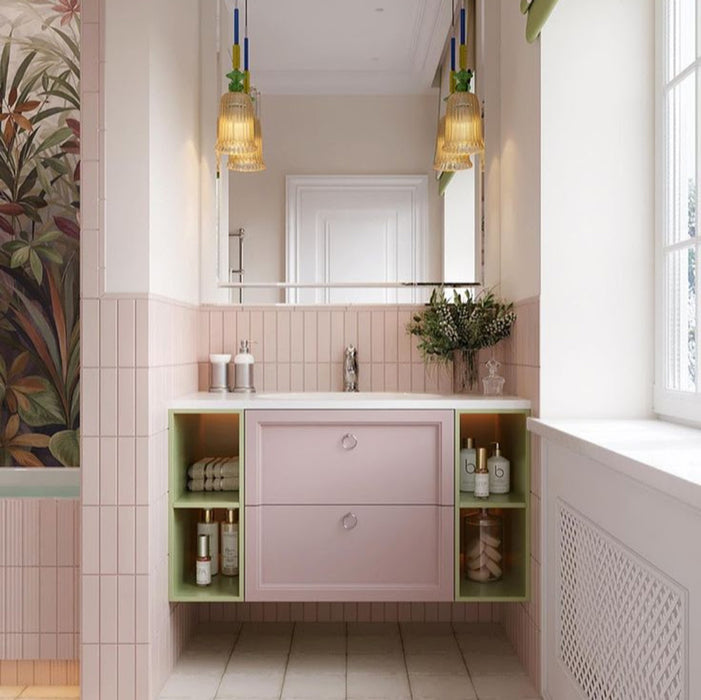 Bathroom interior featuring Rippled Brick Base 5 x 20cm wall tiles in Stony Pink with a gloss finish, installed vertically to enhance height and texture, paired with soft blush cabinetry, warm metallic accents, and a patterned floor to create a calm yet characterful space.