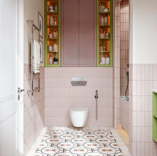Bathroom interior featuring Carnaby Rose 20 x 20cm Victorian style floor tiles, showcasing a soft geometric pattern in blush and neutral tones, paired with vertically stacked blush wall tiles, pastel cabinetry, and layered textures to create a warm, contemporary take on classic design.