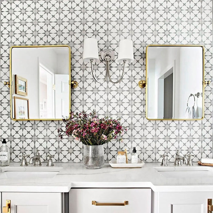 Bathroom featuring Agraba Silver 20x20cm Moroccan tiles used as a wall backdrop behind twin mirrors and a marble vanity, showcasing a soft grey geometric star pattern that adds elegance and sophistication.
