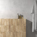 Zellij Arena Brick Moroccan Style 6.5cm x 20cm bathroom setting, warm sandy beige brick tiles with subtle cream and honey tonal variation, lightly textured glazed finish, vertically laid half-height tiled wall creating a soft, spa-like Moroccan-inspired bathroom design.