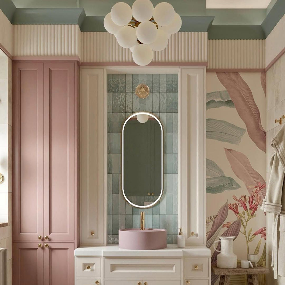 Zellij Aqua Blue brick tiles, 6.5cm x 20cm, Moroccan style, soft aqua blue tones with subtle tonal variation, glossy glazed finish, handcrafted uneven surface, vertically laid brick tiles used as a bathroom vanity feature wall with pastel cabinetry and brass fittings.