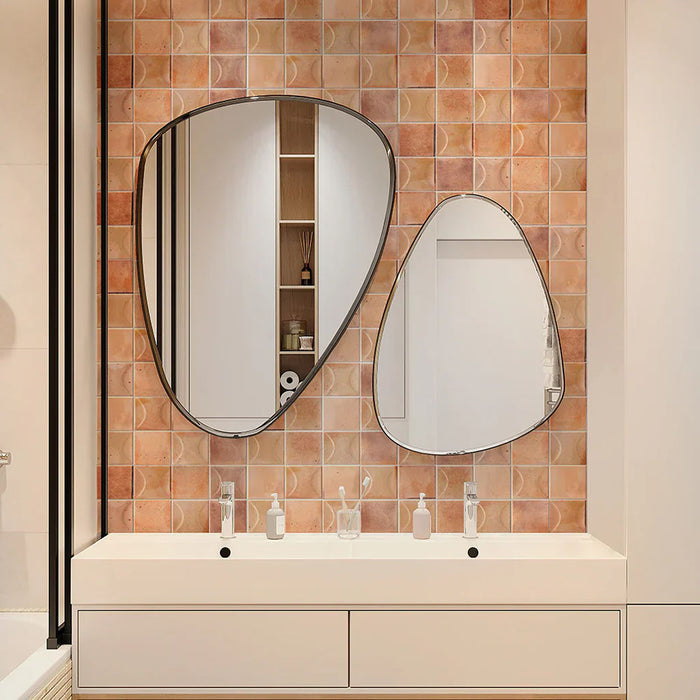 Bathroom featuring Beijing Rose Pink Decor Square 10x10cm Moroccan-style ceramic wall tiles, styled with curved mirrors, gold fittings and a modern white vanity unit.