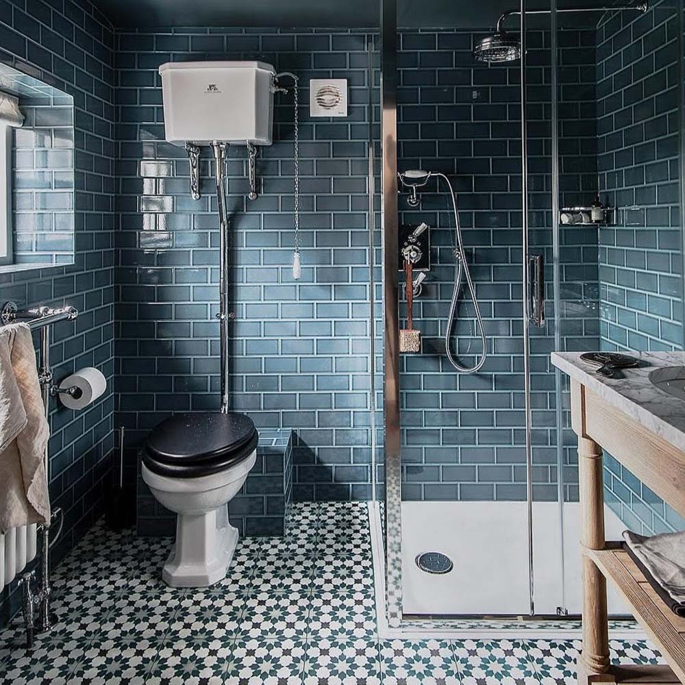 Bathroom featuring Finchley River Blue 7.5 × 15cm ceramic wall tiles with a crackle glaze finish, laid in a classic brick pattern to create a rich, characterful and timeless bathroom design.