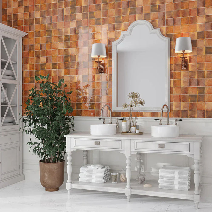Bathroom featuring Beijing Amber Square 10x10cm Moroccan-style ceramic wall tiles, styled with twin basins, white vanity units and traditional brass fittings.