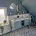 Bathroom setting featuring Georgetown Star Victorian-style 20x20cm patterned porcelain floor tiles, paired with a classic double vanity, metro wall tiles, and soft grey-blue cabinetry.