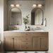 Bathroom setting featuring Atlas White Mini Brick 5x15cm matt wall tiles, laid in a horizontal brick format to create a soft, textured backdrop. The subtle tonal variation and refined matt finish bring a calm, understated feel, paired with warm wood cabinetry, brass fittings, and arched mirrors for a balanced, contemporary look.