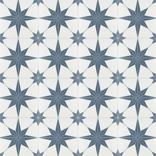 Pole Star Blue Moroccan-style 25x25cm patterned porcelain tiles arranged in a grouped layout, showcasing the repeating blue star motif on a soft white background.