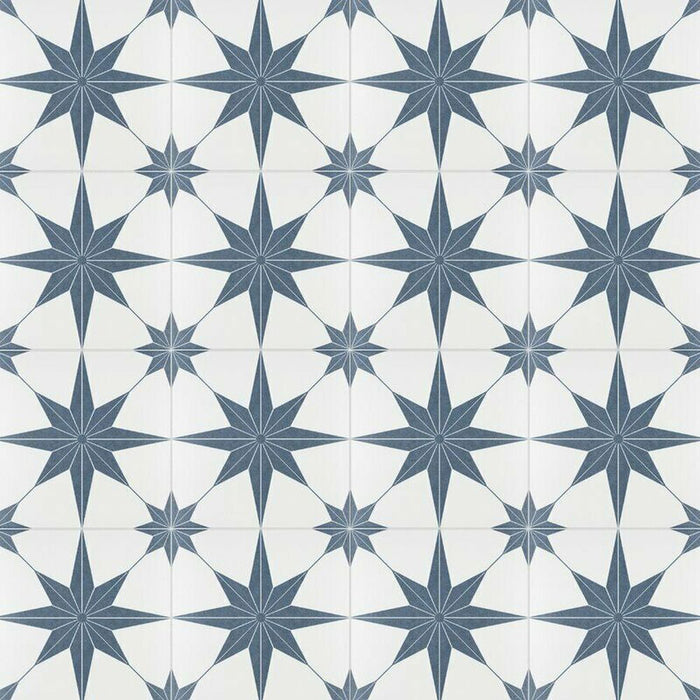 Pole Star Blue Moroccan-style 25x25cm patterned porcelain tiles arranged in a grouped layout, showcasing the repeating blue star motif on a soft white background.