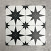 Pole Star Black Moroccan-style 25x25cm patterned porcelain tiles arranged in a grouped layout, showcasing the bold black star motif across a crisp white background.