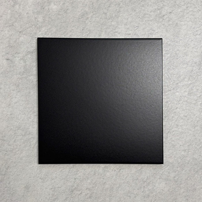 Single Chessboard Black 25×25cm Victorian-style porcelain tile with a smooth satin finish, shown against a light textured background.