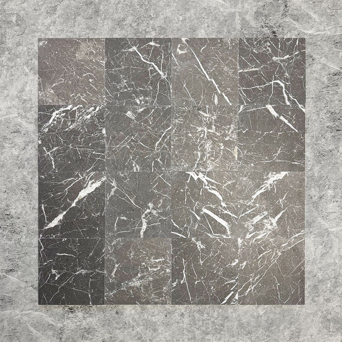 Group of Fitzrovia Black 15.2x15.2cm honed natural marble tiles arranged in a square layout, showcasing deep charcoal tones, bold white veining, tonal variation, and a smooth, refined finish.