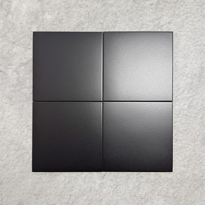 Four Chessboard Black 25×25cm Victorian-style porcelain tiles arranged in a square to show colour, texture, and finish, displayed against a light textured background.
