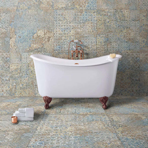 Bathroom featuring Boheme Blend 60 × 60cm patterned porcelain wall and floor tiles, showcasing a soft blend of blue, beige and aged-effect detailing. Paired with a freestanding bath and brass fittings for a relaxed, characterful finish.