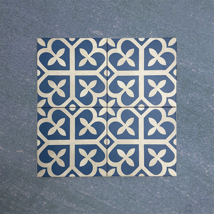 Iris Blue Victorian Moroccan-style 20x20cm patterned porcelain tiles arranged in a tiled group, showcasing a classic blue and white decorative design.
