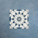 Soukaina Blue A 20cm x 20cm Moroccan-style patterned porcelain tile, featuring a geometric star design in deep blue, white and soft grey tones with a matt finish.