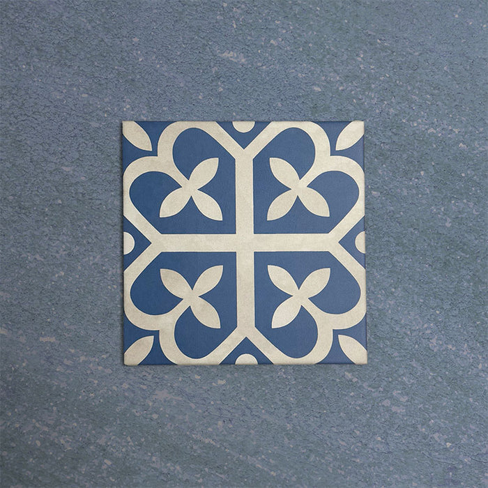Iris Blue Victorian Moroccan-style 20×20cm porcelain tile featuring a soft blue and cream geometric pattern, ideal for adding decorative character to floors and walls in classic and contemporary interiors.