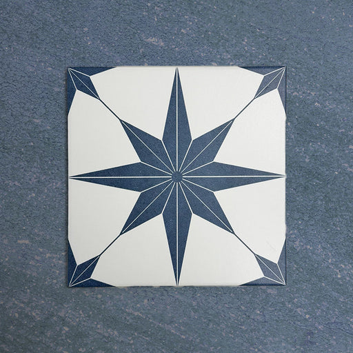 Pole Star Blue Moroccan-style 25x25cm patterned porcelain tile, featuring a bold blue star motif on a crisp white background.