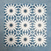 Group of Soukaina Blue B Moroccan-style 20cm x 20cm patterned porcelain tiles, showing a repeating central star design in deep blue, white and soft grey tones with a matt finish.