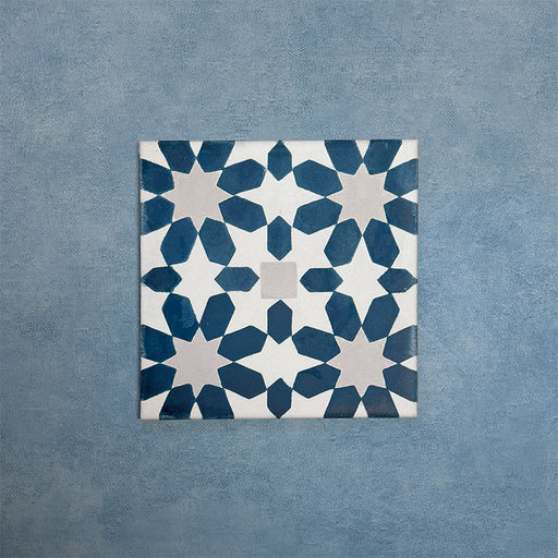 Soukaina Blue C 20cm x 20cm Moroccan-style patterned porcelain tile, featuring a repeating geometric star motif in deep blue and soft neutral tones with a matt finish.
