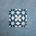Soukaina Blue C 20cm x 20cm Moroccan-style patterned porcelain tile, featuring a repeating geometric star motif in deep blue and soft neutral tones with a matt finish.