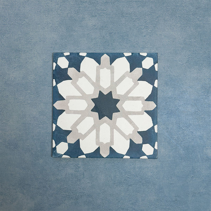 Soukaina Blue D 20cm x 20cm Moroccan-style patterned porcelain tile, featuring a bold central star motif in deep blue, white and soft neutral tones with a matt finish.