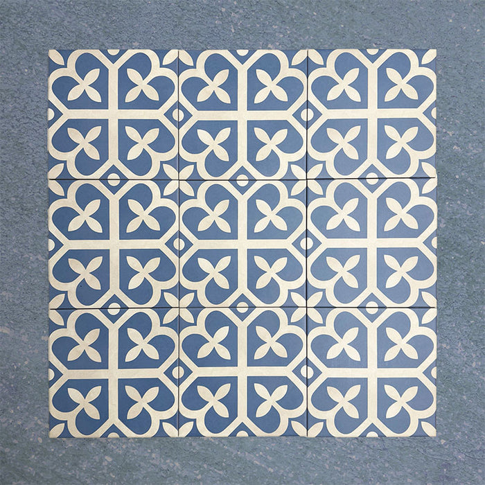 Iris Blue Victorian Moroccan-style 20x20cm patterned porcelain tiles arranged in a tiled group, showcasing a classic blue and white decorative design.