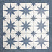 Pole Star Blue Moroccan-style 25x25cm patterned porcelain tiles arranged in a grouped layout, showcasing the repeating blue star motif on a soft white background.