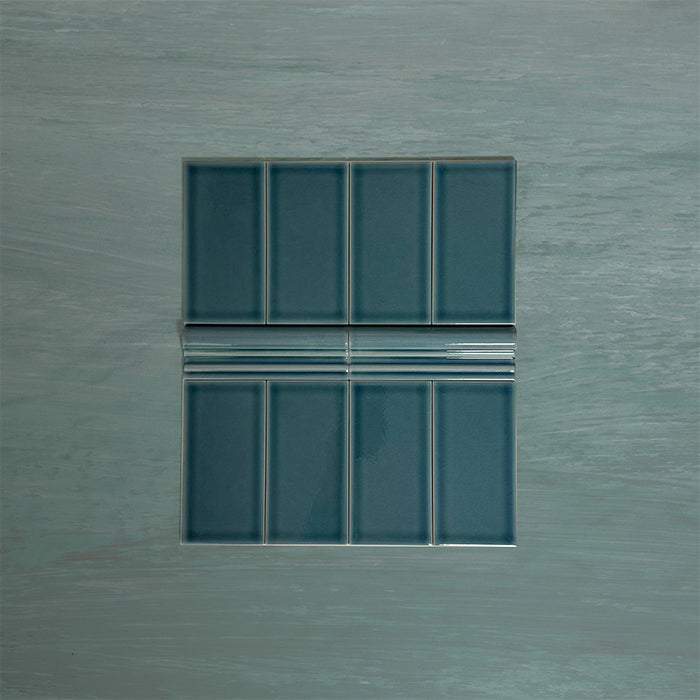 Flat lay showing Finchley River Blue 7.5 × 15cm ceramic wall tiles with a crackle glaze finish, paired with matching 5 × 15cm dado trim to create a decorative, classic brick-style wall tile layout.