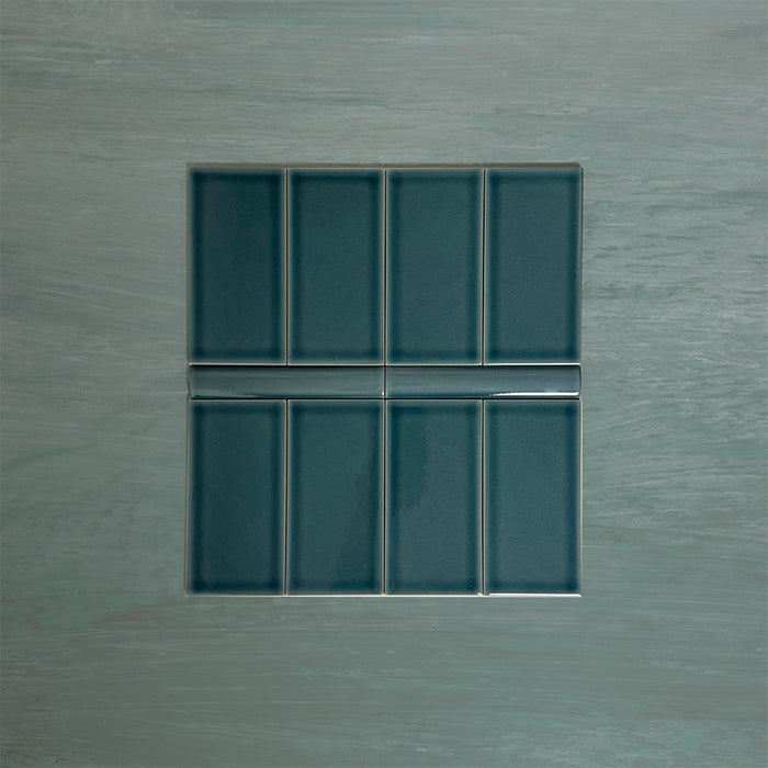 Flat lay showcasing Finchley River Blue 7.5 × 15cm ceramic wall tiles with a crackle glaze finish, paired with matching 2.5 × 15cm pencil trim to create a refined, classic brick-style wall tile layout.