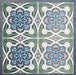 Group of Europa Bucharest 20x20cm Victorian Moroccan style tiles arranged together to showcase the repeating ornamental pattern in blue, green, grey and white tones, displayed against a textured blue background.