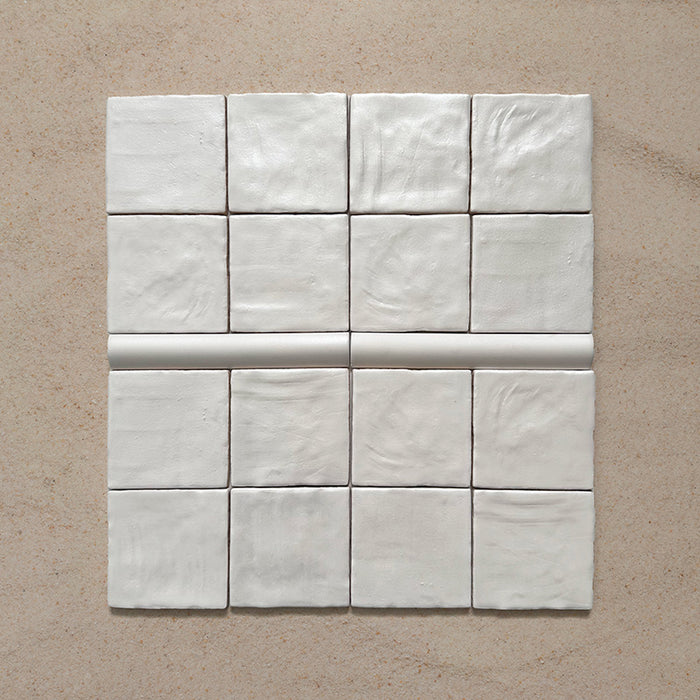 Zellij Oyster Bullnose Moroccan-style trims in a 3cm x 20cm format, featuring a glossy off-white glaze and smooth rounded profile, laid flat on a neutral background.