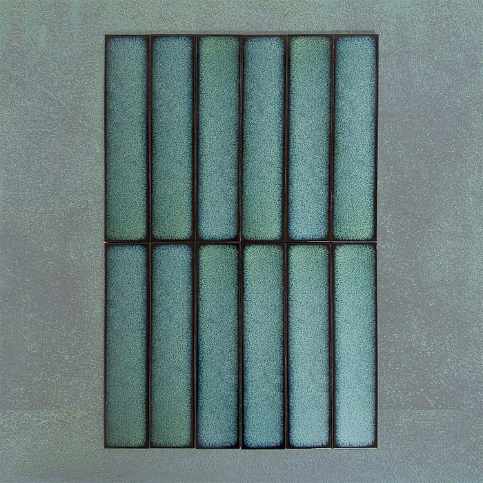 Group of Chemistry Green 6.5cm x 30cm rectangular ceramic wall tiles, showcasing a glossy crackle-effect glaze in rich green tones with an artisan, handcrafted effect finish.