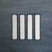 Group of Chemistry White 6.5cm x 30cm rectangular ceramic wall tiles, showcasing a glossy crackle-effect white glaze with subtle tonal variation and an artisan handcrafted effect finish.