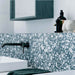 Modern bathroom featuring Chunks POP Terrazzo Blue 60 × 60cm terrazzo-effect porcelain wall tiles, styled with matte black brassware, crisp white surfaces, and contemporary accessories for a clean, playful interior look.