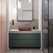 Modern bathroom featuring Chunks POP Terrazzo Green 60 × 120cm terrazzo-effect porcelain wall and floor tiles, paired with deep green cabinetry, a burgundy basin, ribbed glass shower screen, and soft contemporary lighting.