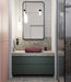 Modern bathroom featuring Chunks POP Terrazzo Green 60 × 120cm terrazzo-effect porcelain wall and floor tiles, paired with deep green cabinetry, a burgundy basin, ribbed glass shower screen, and soft contemporary lighting.