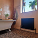 Bathroom featuring Chunks POP Terrazzo Pink 60 × 60cm terrazzo-effect porcelain floor tiles, paired with blush pink wall tiles, monochrome terrazzo shower walls, and a classic freestanding bath for a playful contemporary look.