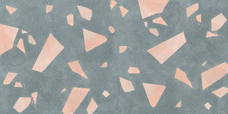 Close-up of Chunks ROCK Terrazzo Green 60 × 120cm terrazzo-effect porcelain tiles, featuring a muted green base with oversized blush pink terrazzo fragments for a bold, contemporary statement surface.