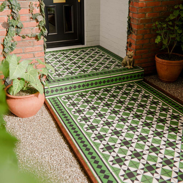 Maison Green Victorian Corner 20cm x 20cm installed floor setting, Victorian patterned corner tile forming a decorative entrance layout, green, black and white geometric design, matt finish, classic heritage Victorian style.