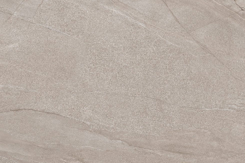 Flat lay of Cocoon Stone Natural 2cm 60 × 90cm porcelain tile, showcasing warm beige stone effect tones with soft, flowing veining and a lightly textured surface. Subtle variation creates a natural, understated finish ideal for indoor and outdoor spaces.