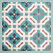 Group of Europa Cologne 20x20cm Victorian Moroccan style tiles arranged together to showcase the repeating geometric pattern in teal, brown, cream and dark blue tones, displayed against a textured aqua background.