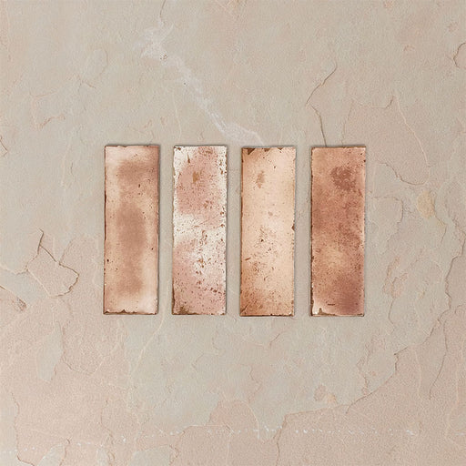 Close-up of Fusion Bricks Coral Pink 6.5x20cm brick wall tiles, showcasing soft tonal variation and lightly textured surface, highlighting warm blush tones and natural variation for a subtle, handcrafted look.