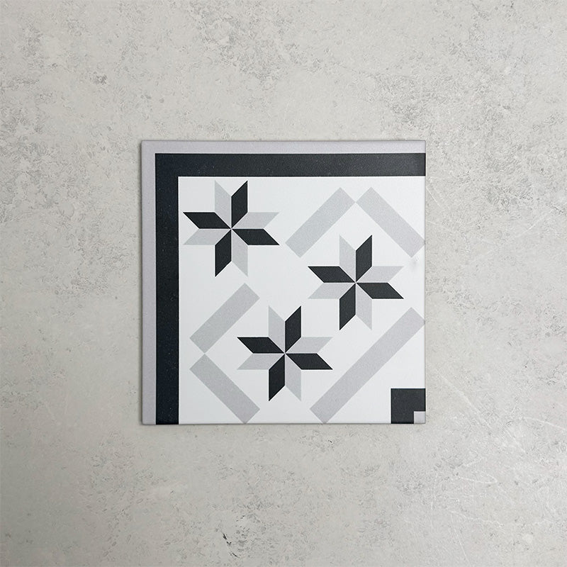 Georgetown Star Corner Victorian-style 20x20cm patterned porcelain tile, featuring a monochrome star motif with coordinating corner and border detailing.