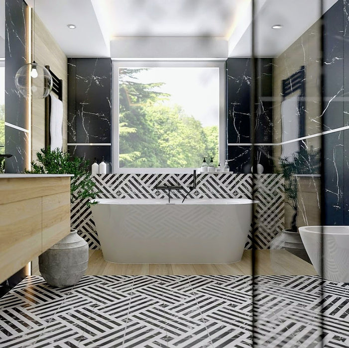 Bathroom interior featuring Decaprio Black & White marble effect patterned porcelain tiles 44 × 44cm, used across the floor and bath panel to create a bold, continuous geometric layout. The structured black and white pattern adds rhythm and contrast, paired with black marble effect wall tiles, wood-effect cabinetry, and matte black fittings for a refined, contemporary finish.
